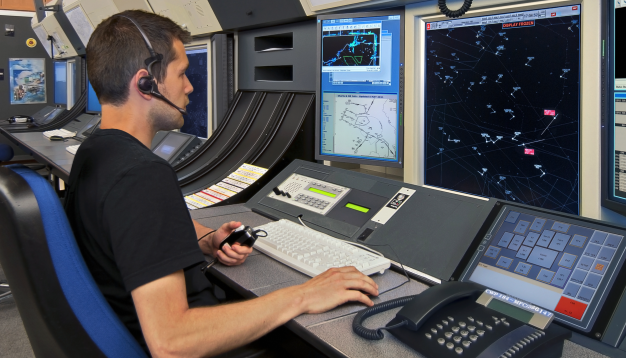 man working at a transportation dispatch station